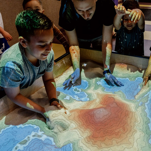 Family exploring Science Central