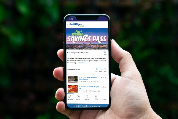 A hand holding the Savings Pass
